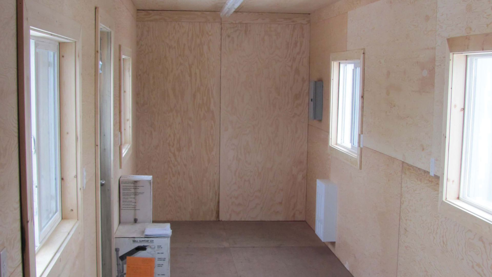 Interior of container covered in plywood